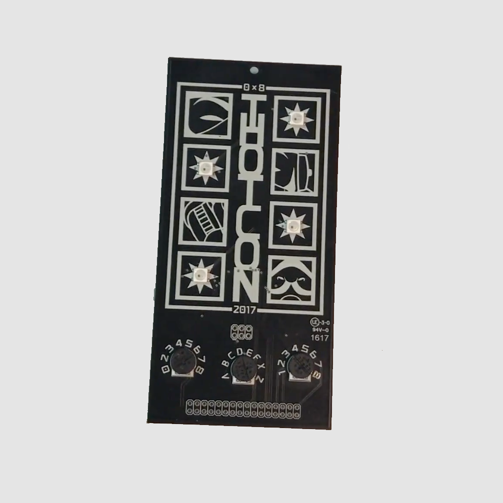 THOTCON 0x8 badge (2017): black board with three knobs
